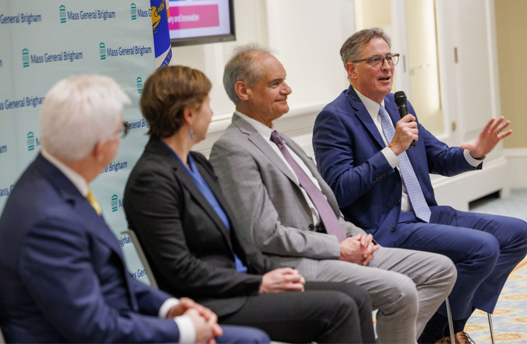 Mass General Brigham Cancer leadership speaking at the Massachusetts State House.