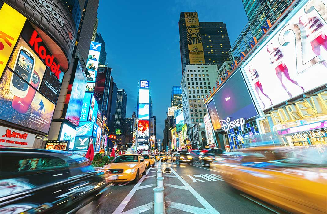 Taxis whizzing through Times Square.