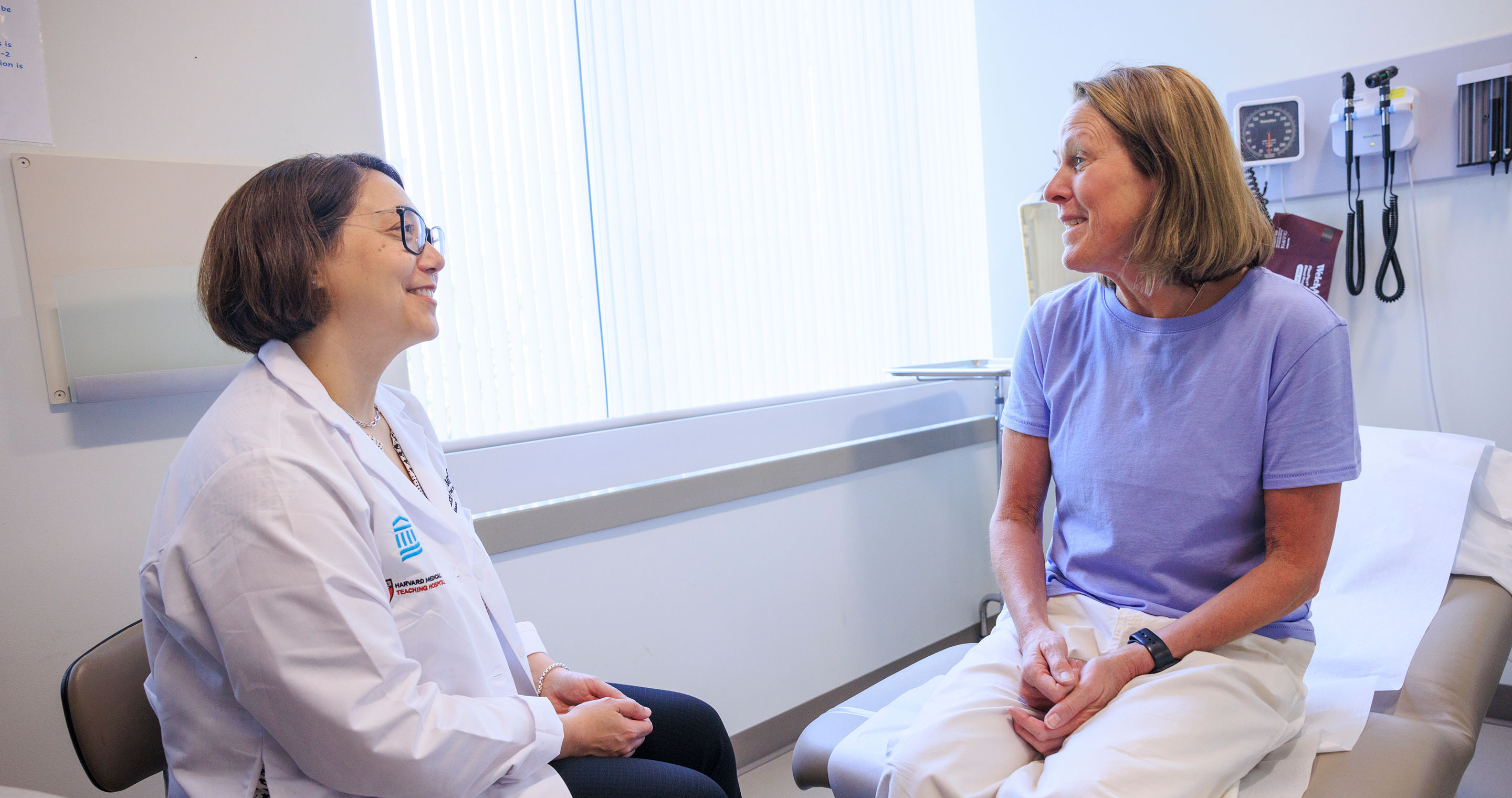 Dr. Lecia Sequist with female patient in exam room