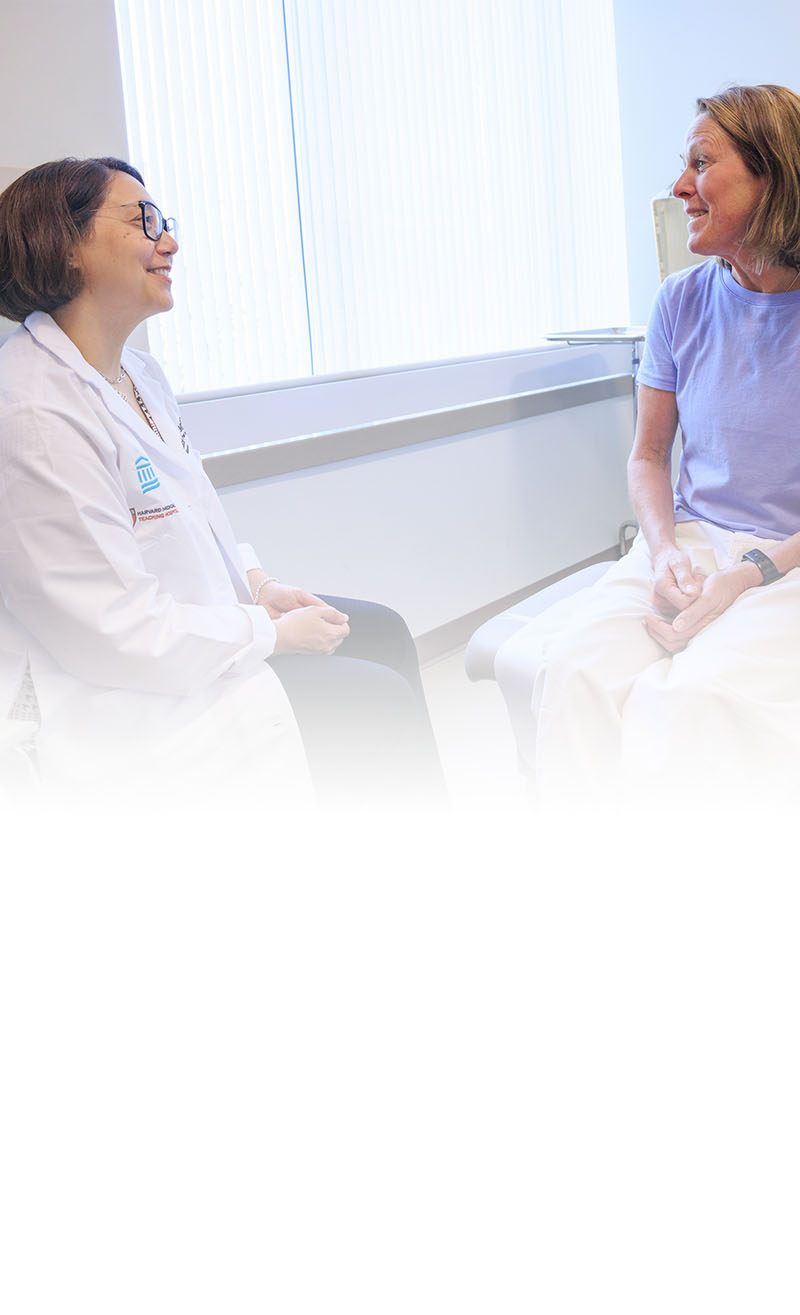 Dr. Lecia Sequist with female patient in exam room