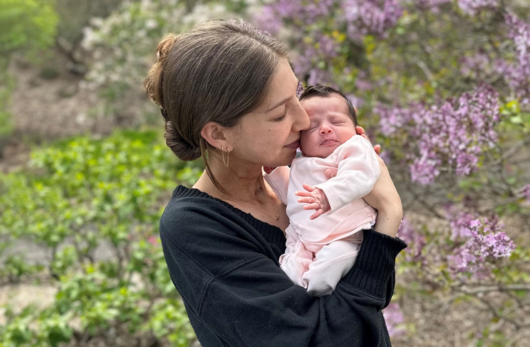 Abbey Bergman holding her baby