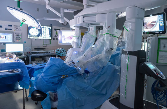 Dr. Clancy performing surgery using the minimally invasive surgical robot.