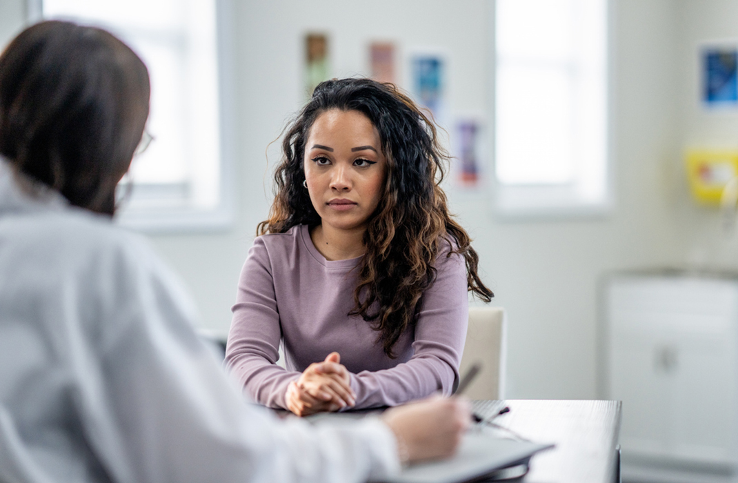 Young woman meeting with a doctor