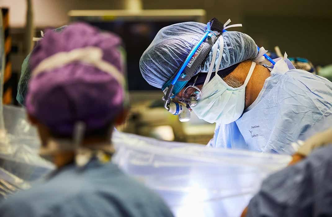 surgeons operating on a patient in the operating room