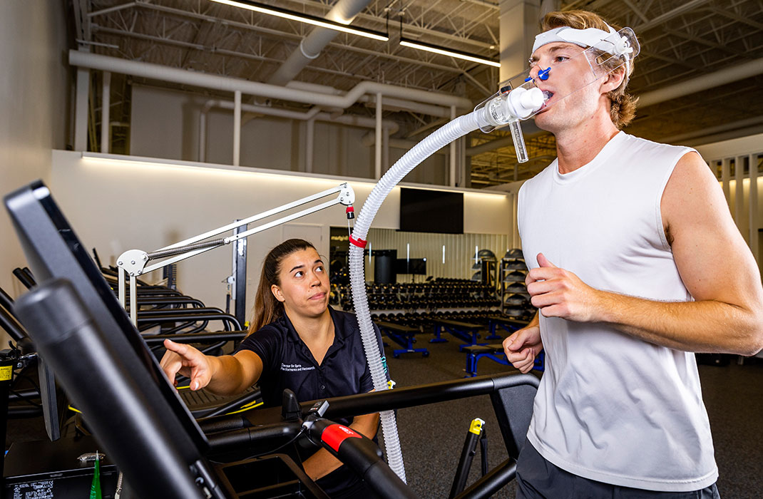 man running on include treadmill with oxygen machine attached to mouth