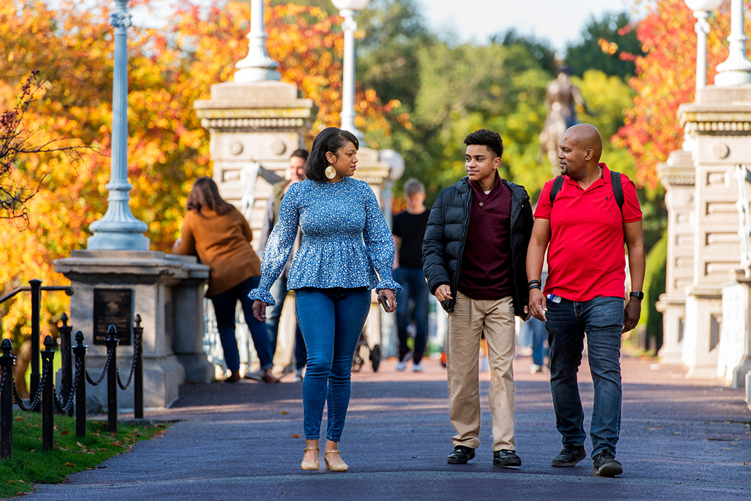 Family walking at Boston Commons during fall