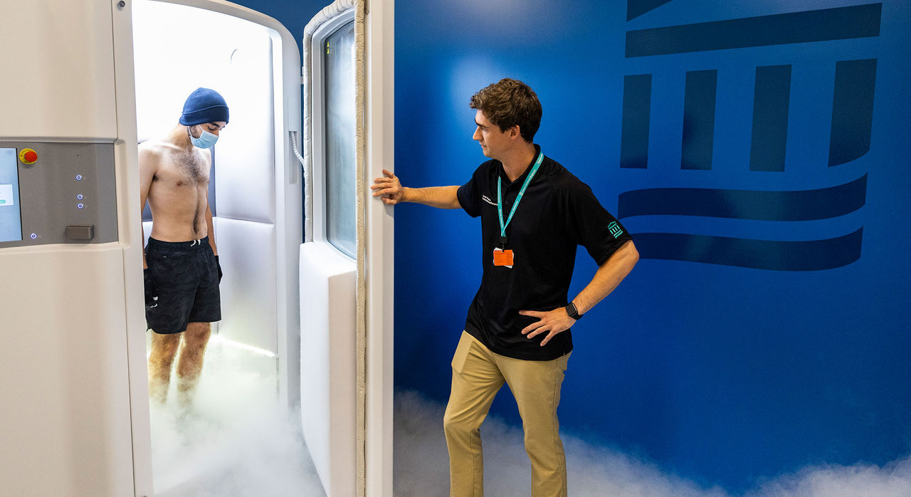 An athlete enters a cryo-chamber