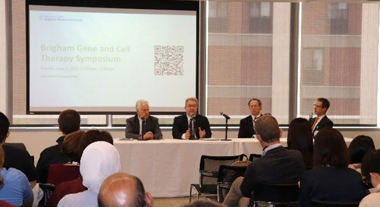 Brigham Gene and Cell Therapy Symposium program panel presents in front of an audience