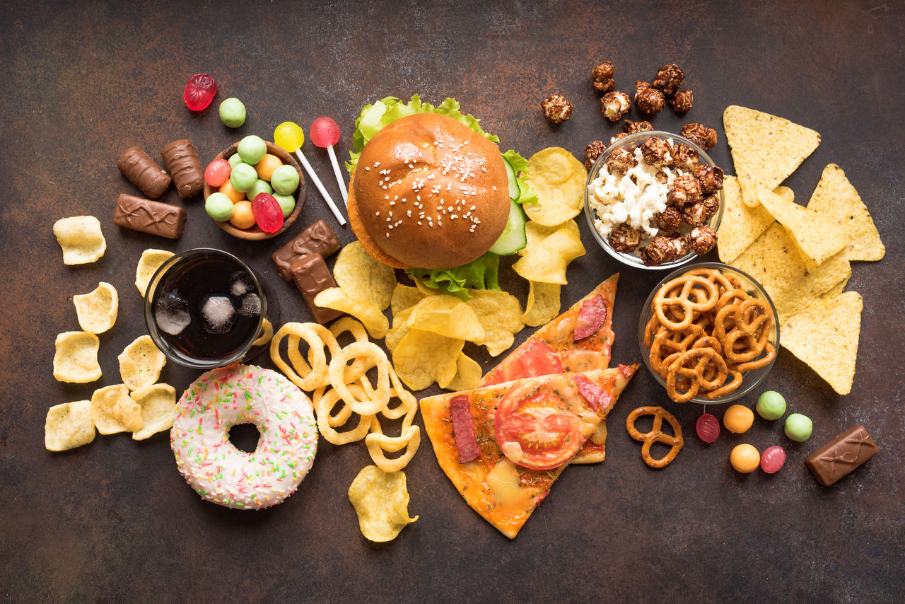 1157591821 Assortment of Unhealthy Food, top view, copy space. Unhealthy eating, junk food concept.