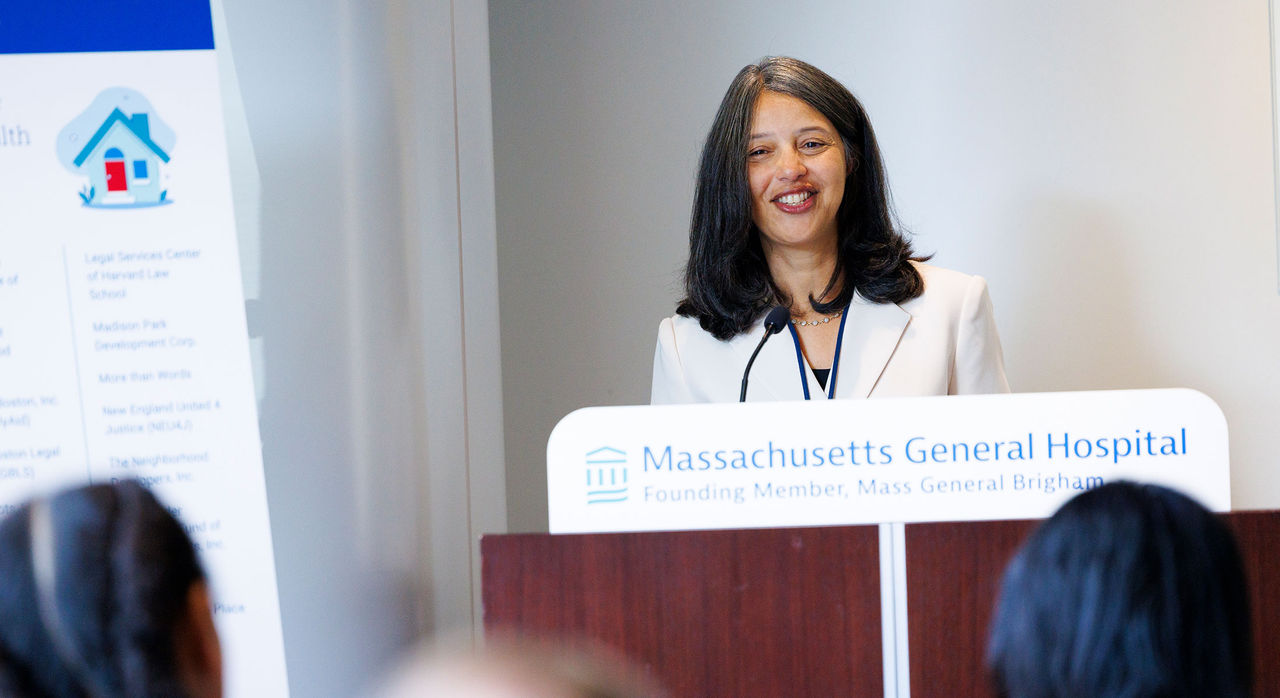 Mass General Brigham chief community health and health equity officer Dr. Elsie Taveras addresses the audience at today’s press conference.