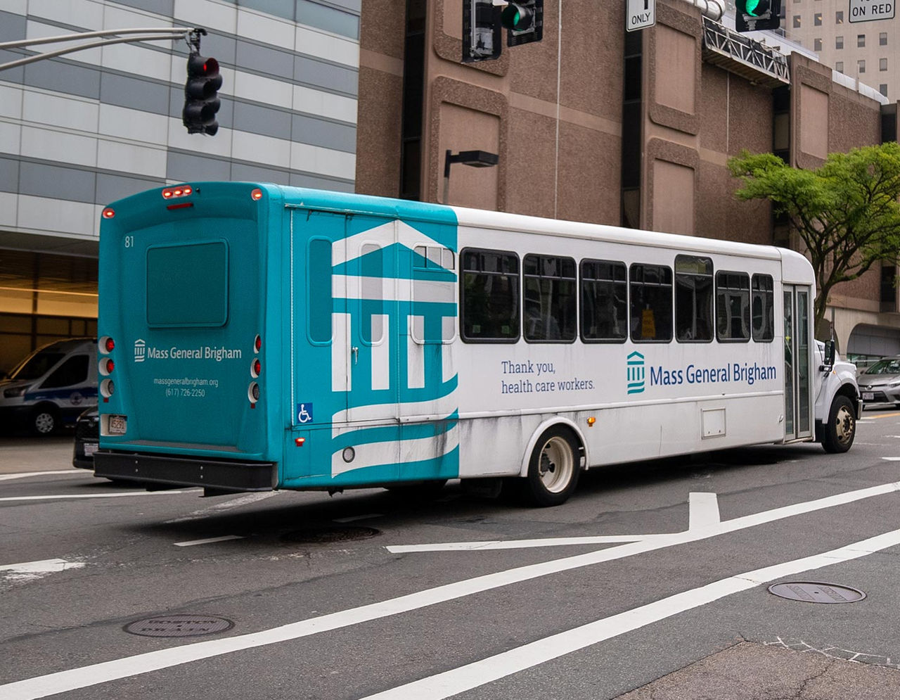 Mass General Brigham Shuttle driving on the road