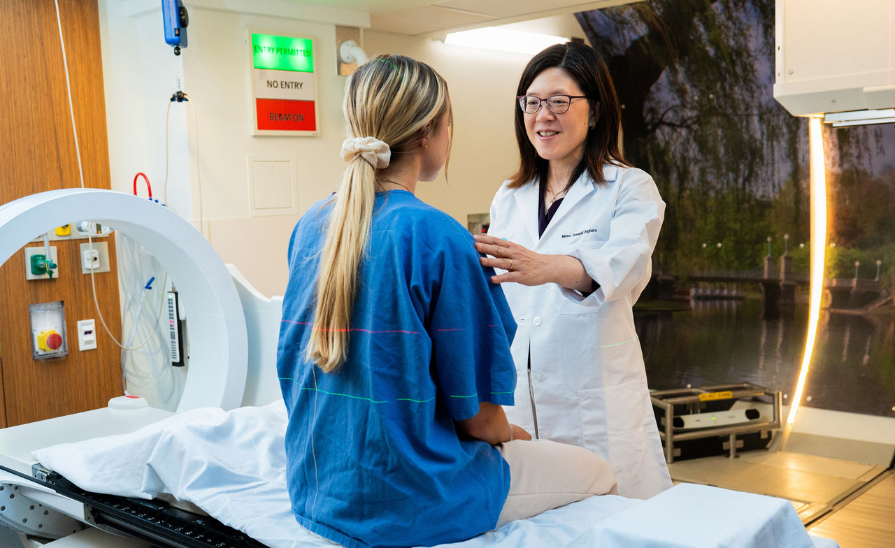 Helen Shih, MD with a patient in the proton therapy center