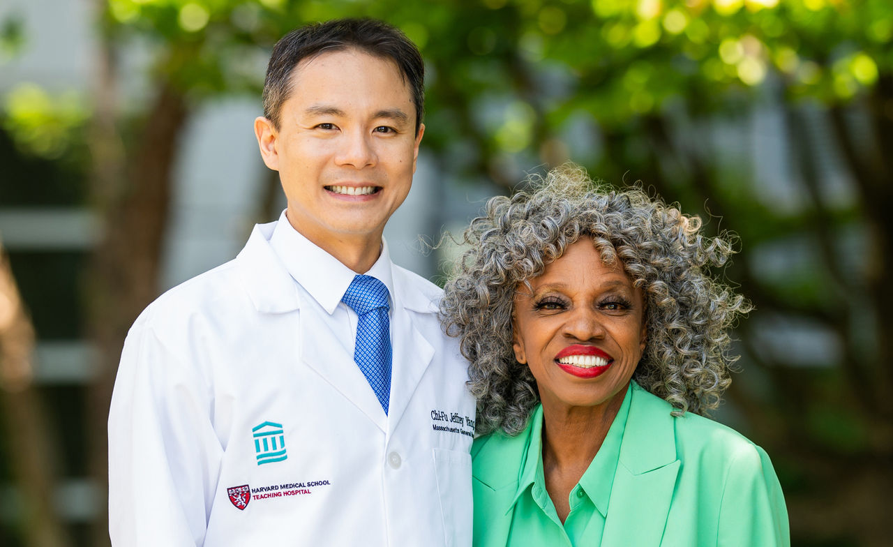  Chi-Fu Jeffrey Yang, MD standing with patient outdoors