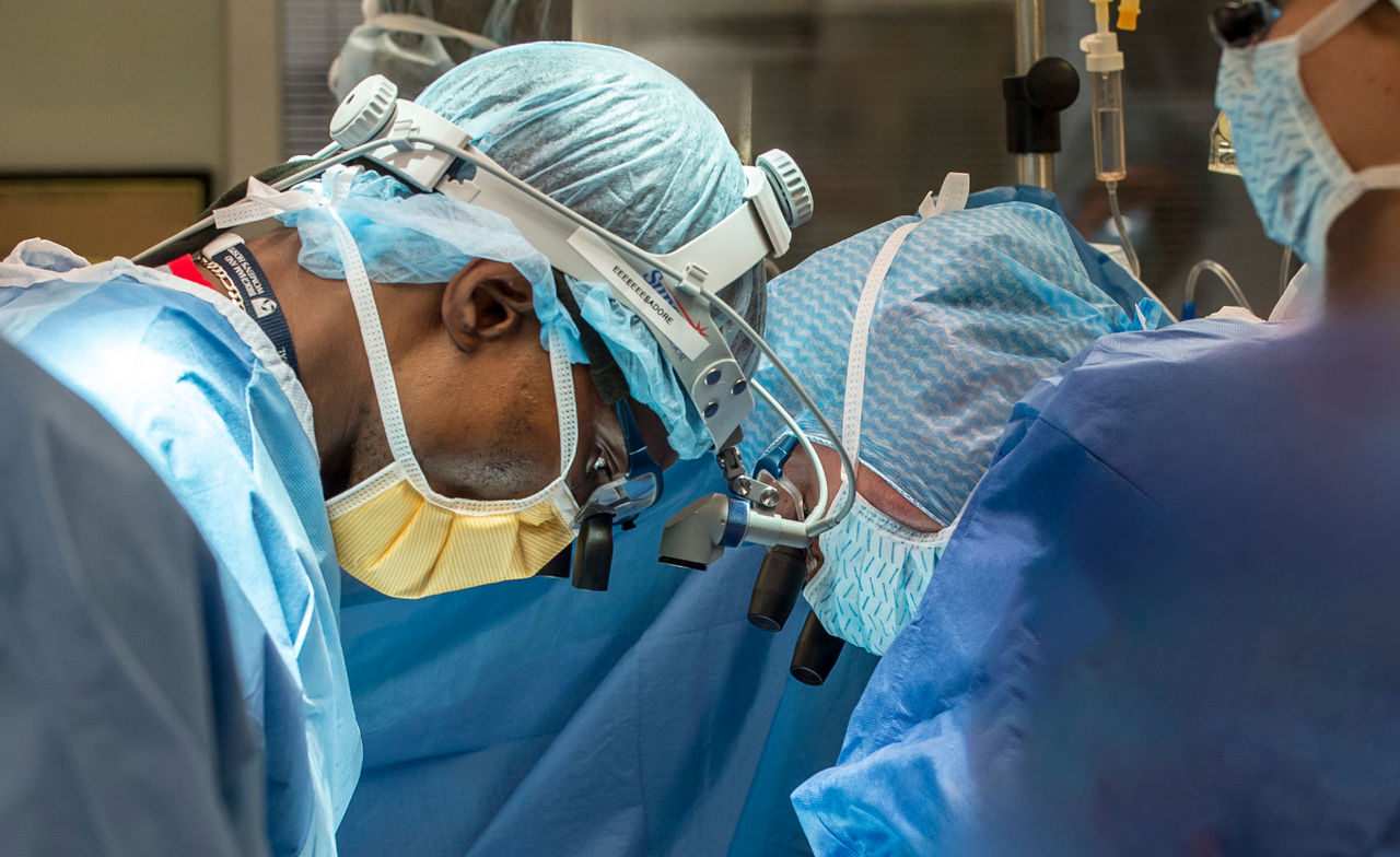 A cardiac surgeon performing surgery