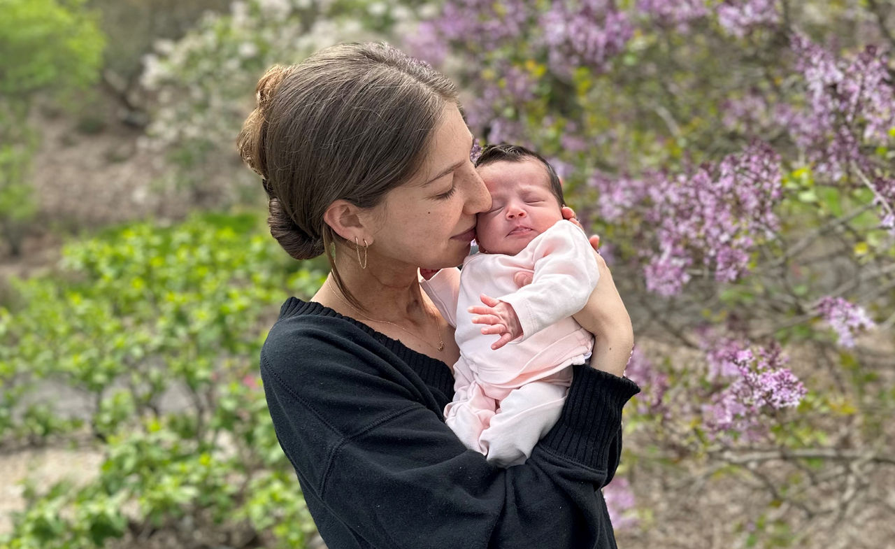 Abbey Bergman holding her baby