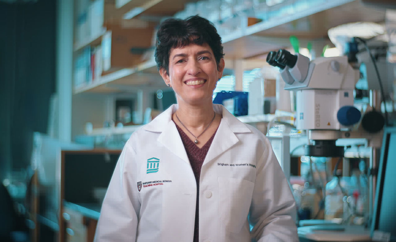 Tanya Mayadas, PhD standing in lab